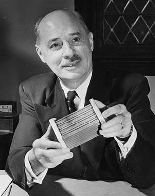 Eugene Houdry, a French mechanical engineer, with the catalytic converter he invented.